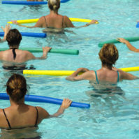 Wemen doing water aerobic in pool